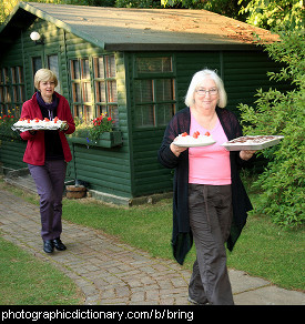 Photo of women bringing cakes