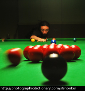 A man playing snooker.