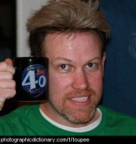 Photo of a man wearing a toupee